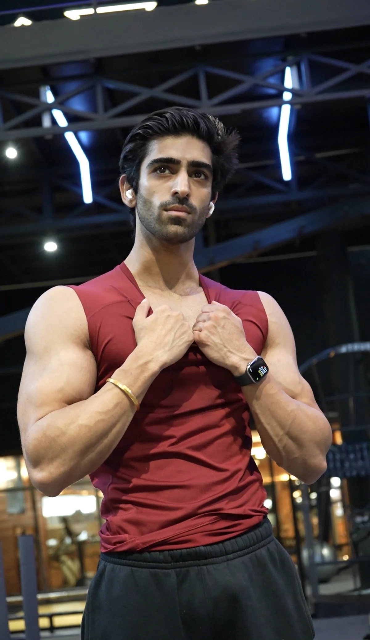 Harshman Arora in a red training shirt at the gym